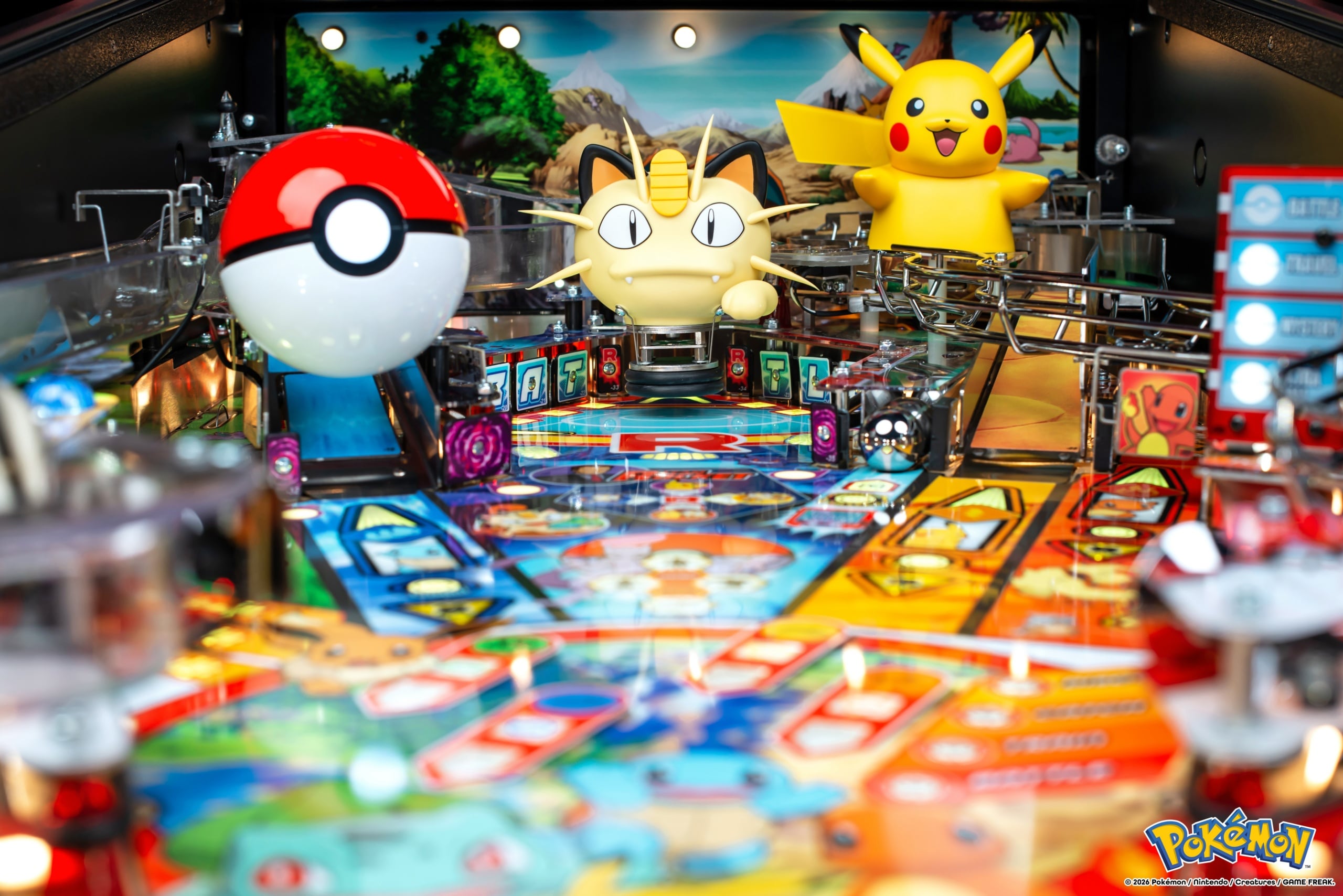 Pokémon pinball playfield close-up with a Poké Ball, Meowth and Pikachu among illuminated ramps
